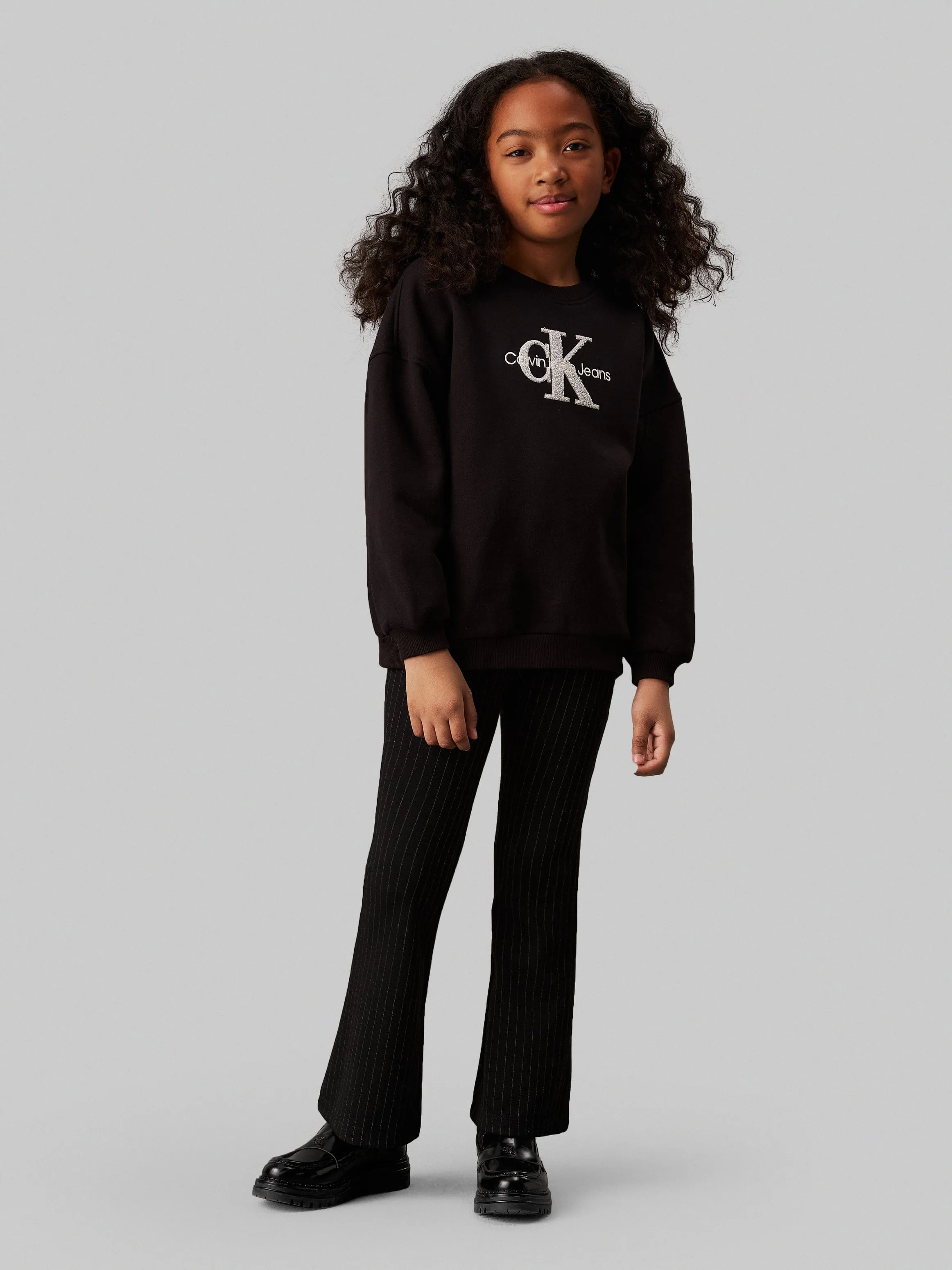 Calvin Klein Mädchen Nadelstreifen Schlaghose in Schwarz